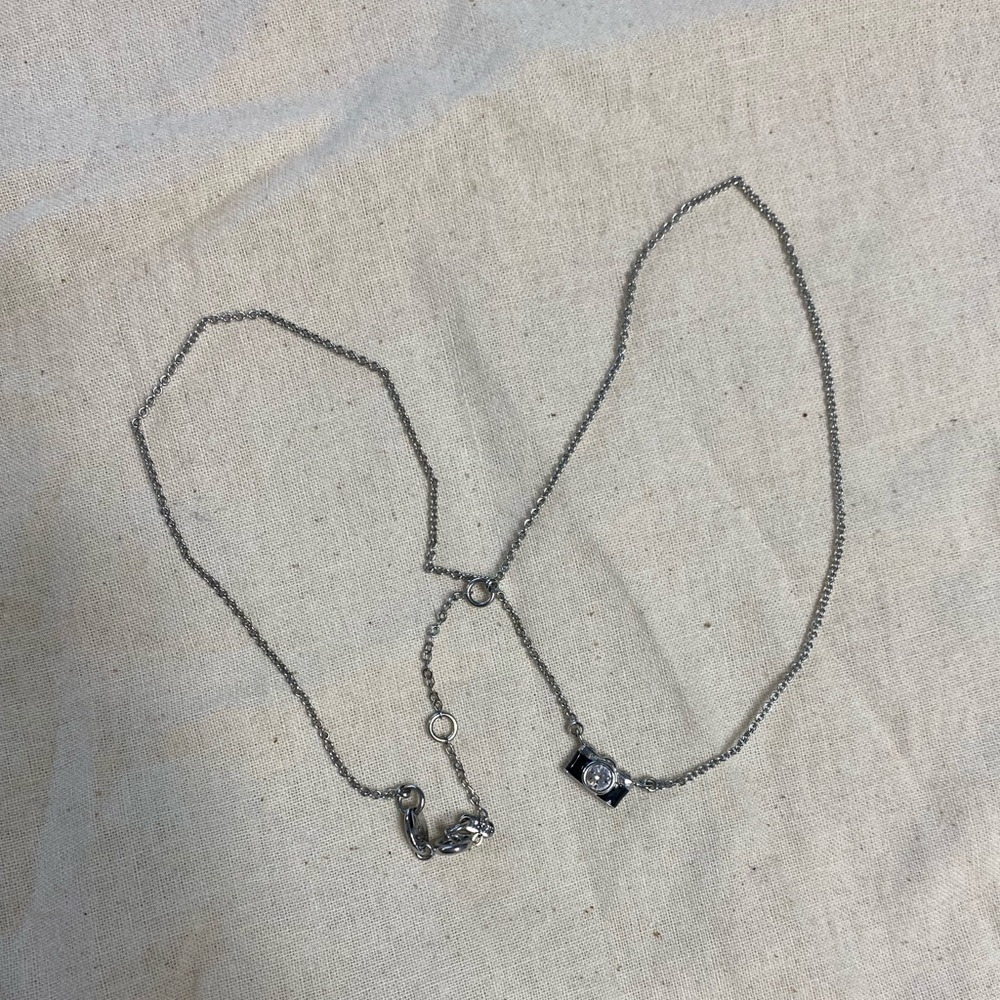 Fossil camera necklace